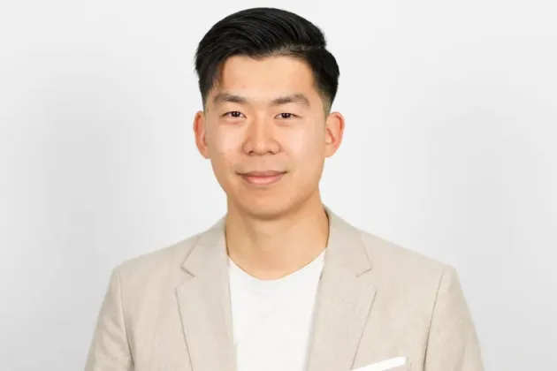 Photo of a man in a linen jacket.